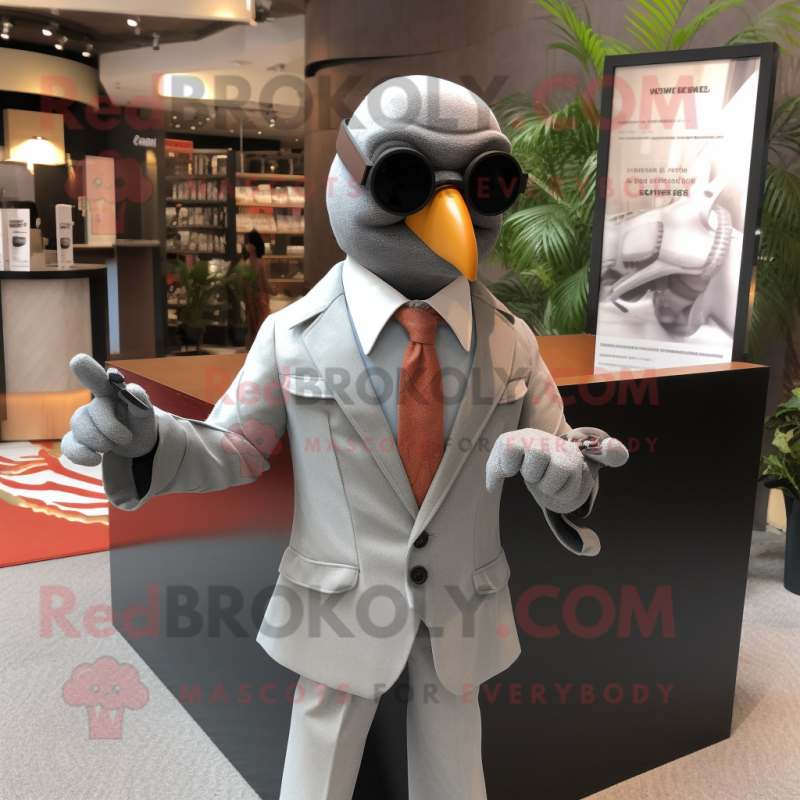 Gray Pigeon mascot costume character dressed with a Blazer and Sunglasses