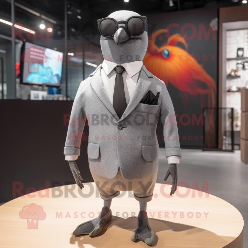 Gray Pigeon mascot costume character dressed with a Blazer and Sunglasses