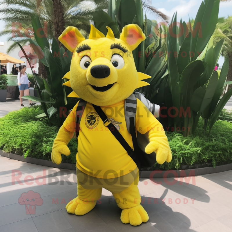 Lemon Yellow Wild Boar mascot costume character dressed with a Bermuda Shorts and Backpacks