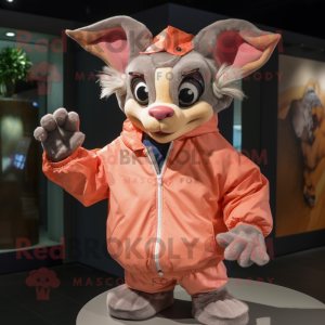 Peach Gargoyle mascot costume character dressed with a Windbreaker and Gloves