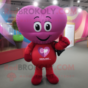 Magenta Heart Shaped Balloons mascot costume character dressed with a Jeggings and Messenger bags