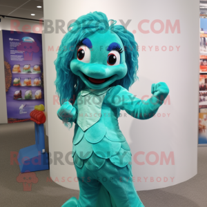 Turquoise Mermaid mascot costume character dressed with a Polo Shirt and Belts