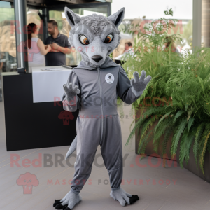 Gray Chupacabra mascot costume character dressed with a Jumpsuit and Lapel pins