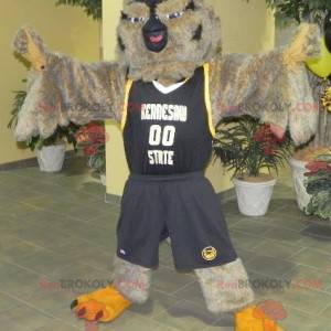 Hnědá a černá sova maskot ve sportovním oblečení -