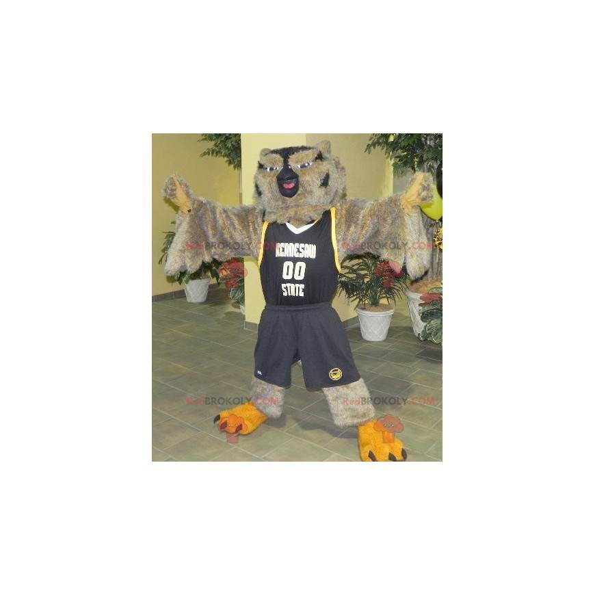Hnědá a černá sova maskot ve sportovním oblečení - Hnědá a černá sova maskot ve sportovním oblečení -