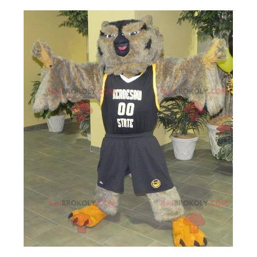 Mascote coruja marrom e preta em roupas esportivas -