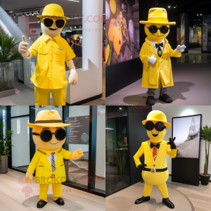Yellow Magician mascot costume character dressed with a Button-Up Shirt and Sunglasses