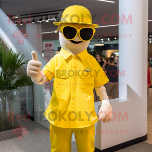 Yellow Magician mascot costume character dressed with a Button-Up Shirt and Sunglasses