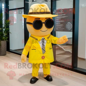 Yellow Magician mascot costume character dressed with a Button-Up Shirt and Sunglasses