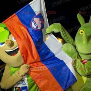 2 mascottes een boom met bladeren en een groene draak -