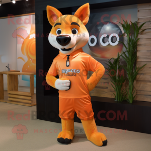 Peach Dingo mascot costume character dressed with a Rash Guard and Tie pins