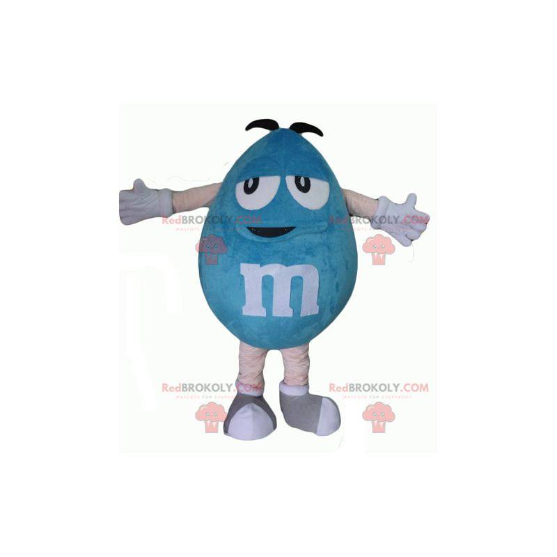Mollige en grappige gigantische blauwe M & M-mascotte -