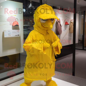 Yellow Fried Chicken mascot costume character dressed with a Raincoat and Caps