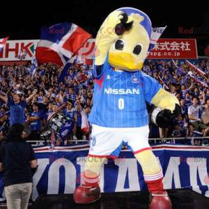 Mascote de pato gigante amarelo em roupas esportivas -