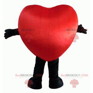 Mascotte de cœur rouge et noir géant et souriant -
