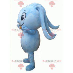 Blauwe sneeuwpopmascotte met dreadlocks en een microfoon -