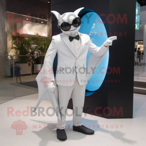 White Manta Ray mascot costume character dressed with a Suit and Eyeglasses