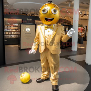 Gold Petanque Ball mascot costume character dressed with a Suit Jacket and Suspenders