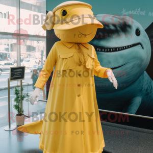 Gold Humpback Whale mascot costume character dressed with a Shift Dress and Berets