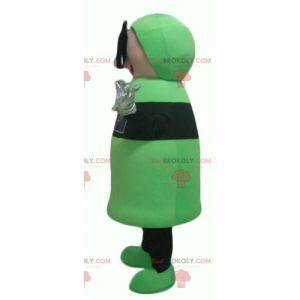 Grünes und schwarzes Schneemannmaskottchen mit 3D-Brille -