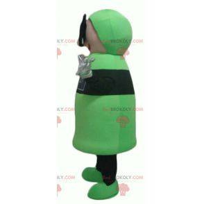 Grünes und schwarzes Schneemannmaskottchen mit 3D-Brille -
