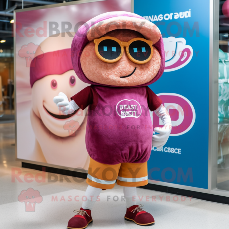 Magenta Bagels mascot costume character dressed with a Cargo Shorts and Reading glasses