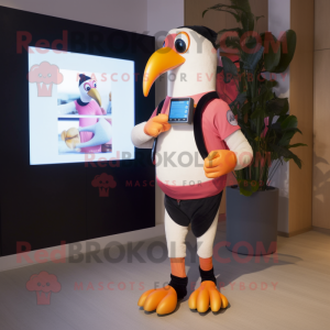 Peach Toucan mascot costume character dressed with a Leggings and Digital watches