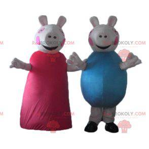 2 mascottes de cochons l'un en robe rouge l'autre en bleu -