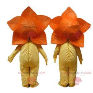 2 Maskottchen mit orangefarbenen Blüten und gelben Lilien -