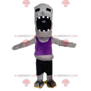 Mascote zumbi cinza engraçado e gigante - Redbrokoly.com