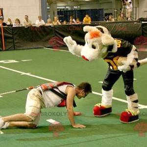 Mascot tigre beige y negro en ropa deportiva - Redbrokoly.com