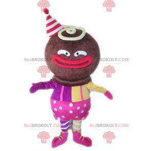 Mascotte personaggio africano vestito di rosa e giallo -