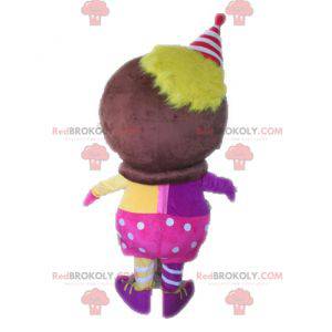 African character mascot dressed in pink and yellow -