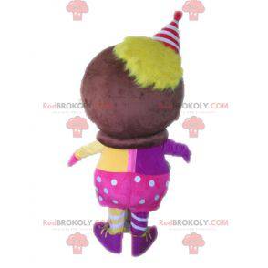 Mascotte personaggio africano vestito di rosa e giallo -