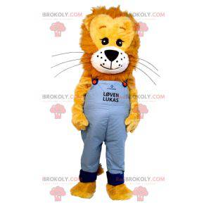 Mascotte del cucciolo di leone con la tuta dei jeans -