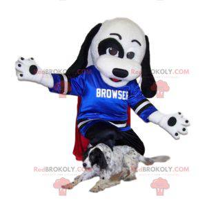 Mascotte cane bianco e nero con la sua maglia blu per sostenere
