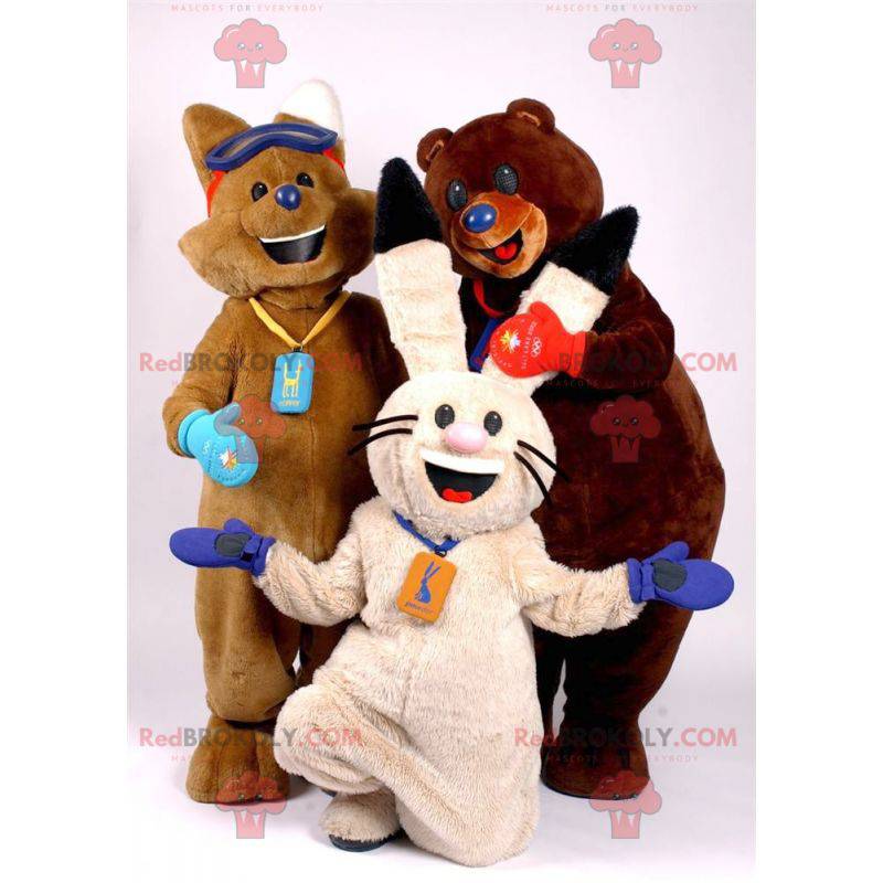 3 mascotes uma raposa marrom, um coelho branco e um urso marrom
