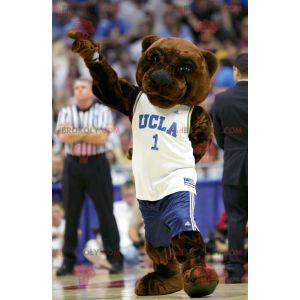 Mascotte dell'orso bruno in abbigliamento sportivo bianco e blu