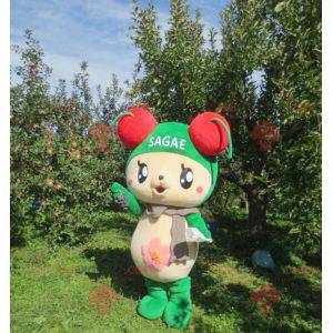 Beige en groene teddybeer mascotte met kersen op zijn hoofd -