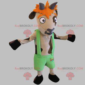 Mascotte mucca marrone e beige con pantaloncini bretelle -