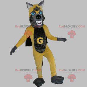 Gelbes und graues Wolfsmaskottchen mit einem Umhang -