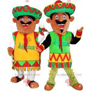 2 Mexican mascots dressed in traditional outfits -