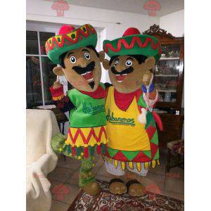 2 Mexican mascots dressed in traditional outfits -
