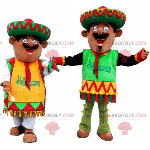 2 Mexican mascots dressed in traditional outfits -