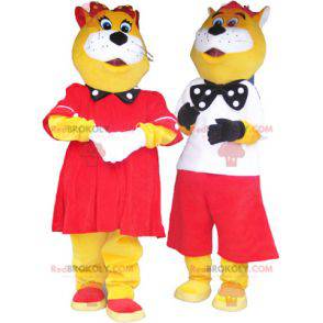 2 mascottes van gele en witte katten, goed gekleed -