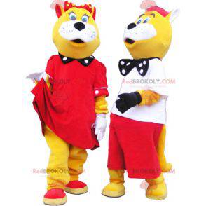 2 mascotes de gatos amarelos e brancos bem vestidos -