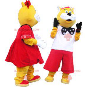 2 mascotes de gatos amarelos e brancos bem vestidos -