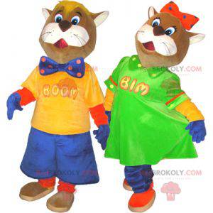 2 mascots of brown and white cats in colorful outfits -