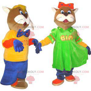 2 mascots of brown and white cats in colorful outfits -