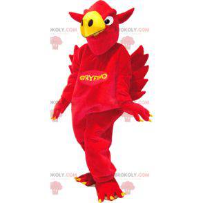 Mascot red and yellow griffin with wings in the back -